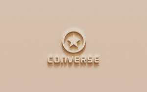 米色牆壁上凸起的Converse標誌及星星徽章 — Converse 標誌 壁紙