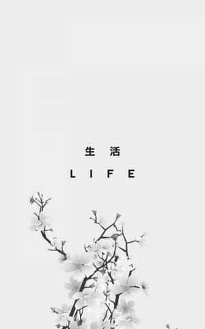 帶有粗體字LIFE的櫻花枝條。 — Redmi Pad 壁紙