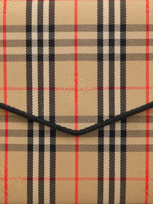 米色格紋布料的特寫，帶有黑色和紅色條紋。 — Burberry 壁紙