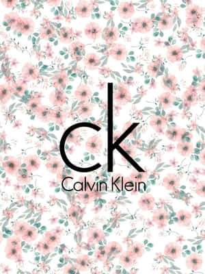 Calvin Klein標誌在粉紅和青綠花卉壁紙上。 — 卡文克萊 壁紙