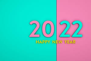 粉紅色和藍綠色的Happy New Year 2022文字，位於分割的粉紅色和藍綠色背景上。 — 新年快樂 2020 壁紙