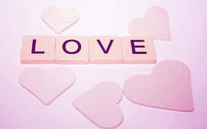 粉紅色瓷磚拼出LOVE，周圍有半透明心形。 — 美學粉色GIF 壁紙