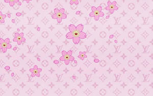 粉紅色的櫻花帶著笑臉，在 Louis Vuitton 字母組合圖案背景上。 — 粉嫩粉彩美學 壁紙