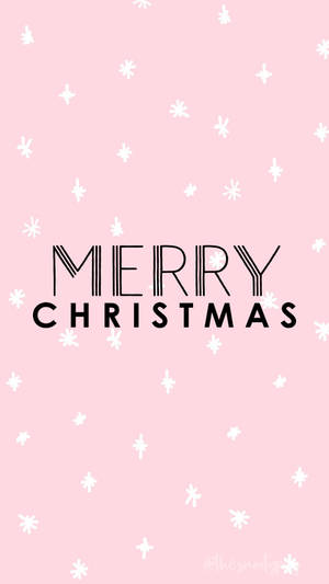 粉紅色桌布，帶有白色雪花和黑色Merry Christmas文字。 — 聖誕節手機 壁紙