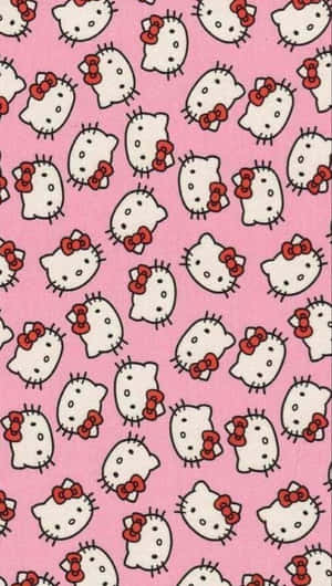重複Hello Kitty面孔戴紅色蝴蝶結的粉紅色桌布。 — 凱蒂貓 美學 GIF 壁紙