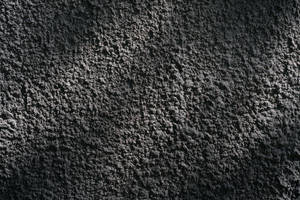 帶紋理的深灰色混凝土牆面特寫。 — 混凝土 壁紙