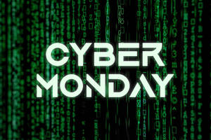Cyber Monday 文字在落下的綠色數位代碼上方發出白色光芒。