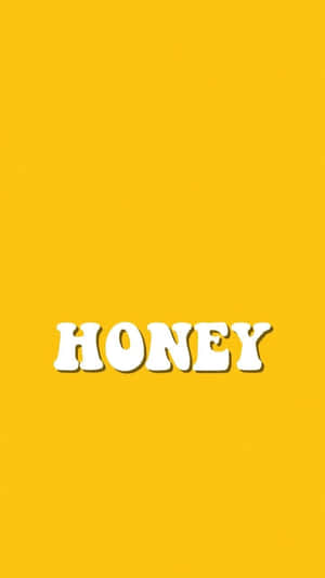 在純黃色背景上寫有 honey 的粗體白色文字。 — 黃色美學 GIF 壁紙