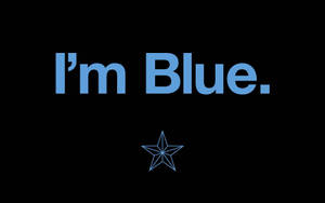 藍色文字寫著「I'm Blue」，下方有一顆藍色星星，背景黑色。 — 藍色美學電腦 壁紙