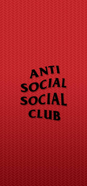 帶有紋理的紅色背景，粗體黑色 Anti Social Social Club 文字。 — iPhone 15 Pro 壁紙