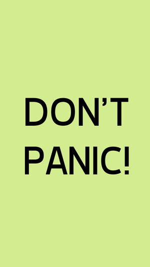 粗體黑色文字 'DON'T PANIC!' 在淺綠色背景上。 — 舊金山 iPhone 壁紙