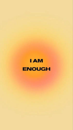 在溫暖的漸變背景上的勵志文字「I AM ENOUGH」。 — 肯定語 壁紙