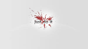 簡約桌布，帶有紅色油漆飛濺和粗體文字 just do it。 — 就去做吧 壁紙