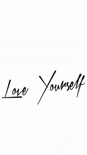白色背景上黑色草書文字「Love Yourself」 — 玫瑰金 壁紙
