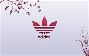 紅色Adidas標誌，帶有裝飾性花卉藤蔓，位於漸變背景上。 — 愛迪達 GIF 壁紙