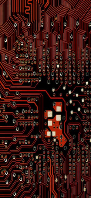 紅色電路板的詳細視圖，帶有電子元件。 — iPhone 16 Pro Max 壁紙