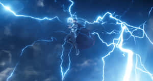 索爾在閃電環繞的暴風雨中飛行。 — 驚奇隊長 壁紙