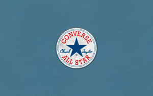 藍色牛仔布背景上的 Converse Chuck Taylor All Star 標誌 — Converse 標誌 壁紙