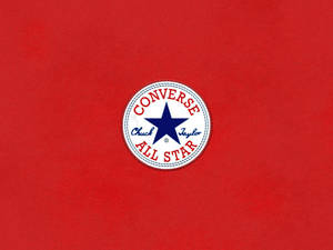 Converse Chuck Taylor All Star標誌在紅色布料背景上 — Converse 標誌 壁紙