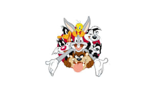 一群Looney Tunes卡通角色微笑並一起擺姿勢。 — 樂一通 壁紙