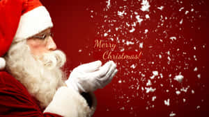 聖誕老人吹雪花，紅色背景上有「Merry Christmas!」文字。 — 聖誕老人 壁紙