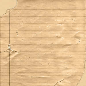 破損米色橫線筆記本紙張的特寫，帶有摺痕和質感。 — Old Paper 壁紙