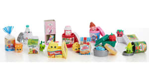 一排帶有笑臉的Shopkins玩具食物產品。 — 玩具總動員叉奇 壁紙