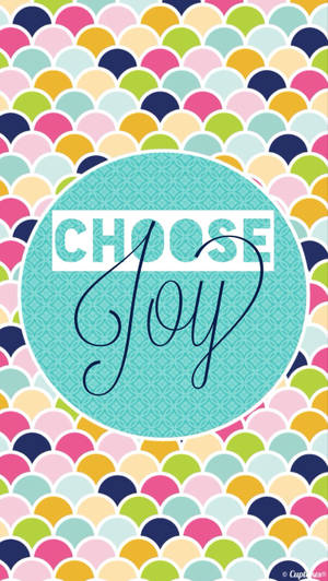 色彩繽紛的扇形圖案，帶有包含「Choose Joy」文字的青綠色圓圈。 — 喜悅 壁紙