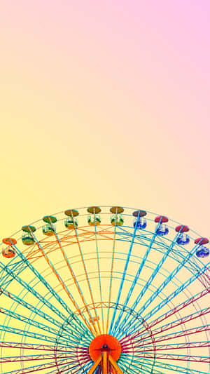 彩虹色的摩天輪襯托著粉彩天空。 — 插畫 iPhone 壁紙