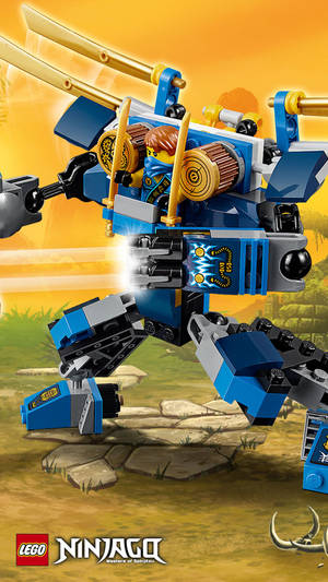 藍色LEGO Ninjago機甲配金色刀片，在岩石地面日落時分。 — 樂高旋風忍者 壁紙