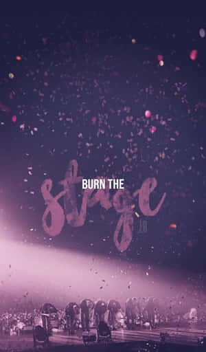 音樂會表演者在紫色舞台燈光下鞠躬，五彩紙屑飄落，文字為 burn the stage。 — Galaxy Tab A 壁紙