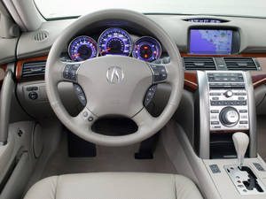 米色皮革車內裝，配備木質飾邊和藍色照明儀表板。 — Acura 壁紙