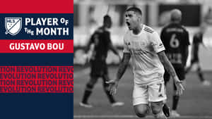 足球員古斯塔沃·保以黑白風格慶祝，並帶有「Player of the Month」文字疊加。 — 阿根廷 壁紙