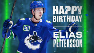 身穿藍色球衣的冰球運動員Elias Pettersson以五彩紙屑和綠色燈光慶祝生日。 — 運動 壁紙