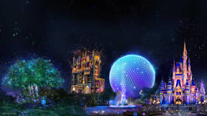 迪士尼世界的城堡和太空船在星空下的夜晚亮起燈光。 — 迪士尼樂園 壁紙