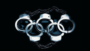 黑色背景上由手銬組成的奧運五環。 — 懲罰者標誌 壁紙