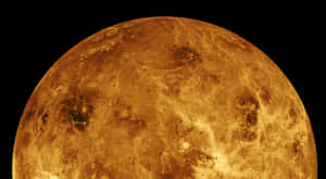 金星行星在太空中帶有旋轉的金色雲層 — 啊！我的女神 壁紙