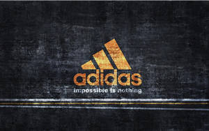 深色紋理牆上的Adidas標誌與口號impossible is nothing。 — 愛迪達 GIF 壁紙
