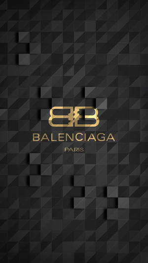 金色Balenciaga標誌在帶有浮動立方體的黑色幾何背景上。 — 巴黎世家 壁紙