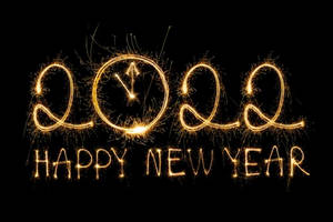 煙火燈光在黑色背景上拼出2022年及新年快樂。 — 新年快樂 2020 壁紙