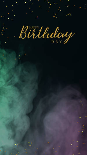金色生日快樂文字在彩色煙霧和亮粉顆粒上。 — 生日祝福 壁紙