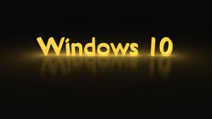 金色 Windows 10 標誌在黑暗背景上帶有發光反射。