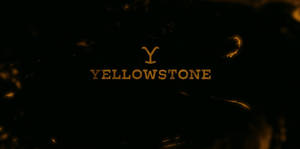 金色 Yellowstone 標誌在黑暗背景上帶有發光火花
