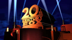 夜晚被藍色聚光燈照亮的金色20th Century Fox標誌。 — 九尾狐 壁紙
