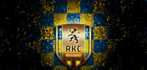 RKC Waalwijk 足球會標誌，獅子徽章配以馬賽克藍黃背景。 — 昏暗 壁紙