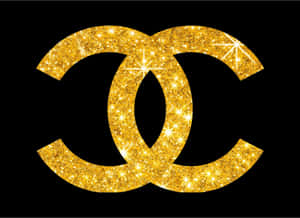 黑色背景上的金色閃粉 Chanel 標誌 — 香奈兒 壁紙