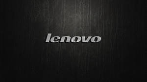 黑色皮革紋理上的閃亮銀色 Lenovo 標誌。 — 聯想高畫質桌布 壁紙