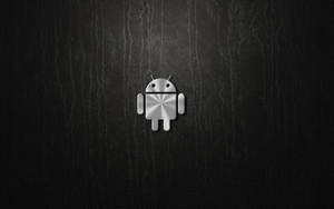 黑色皮革紋理上的閃亮銀色Android機器人標誌。 — 可愛的機器人 壁紙