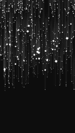 在黑色背景上墜落的發光白色星星的天雨。 — 深色 iPhone 壁紙