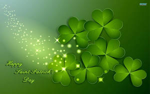 帶有閃光和Happy Saint Patrick's Day文字的綠色四葉草。 — 16:10 壁紙